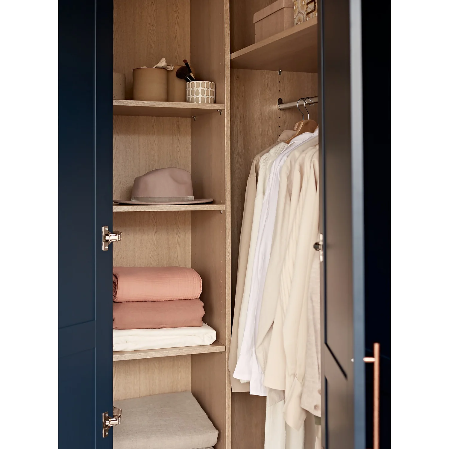 House Beautiful Realm Fitted Look Corner Wardrobe, Oak Effect Carcass - Navy Blue Shaker Doors (W) 1103mm x (H) 2256mm House Beautiful Realm Fitted Look Corner Wardrobe, Oak Effect Carcass - Navy Blue Shaker Doors (W) 1103mm X (H) 2256mm -Famous Furniture Store 13999801 1385036420733423