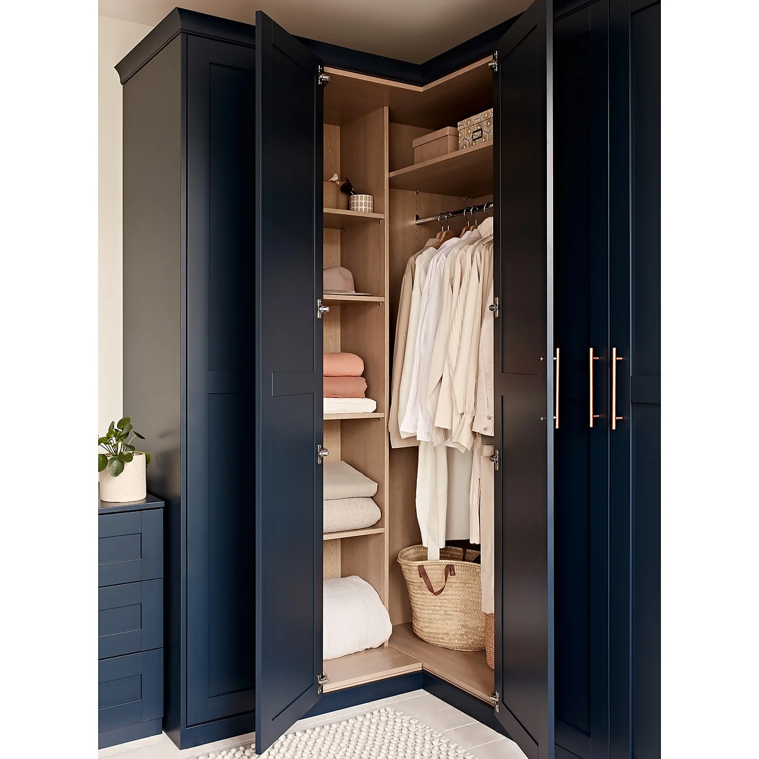 House Beautiful Realm Fitted Look Corner Wardrobe, Oak Effect Carcass - Navy Blue Shaker Doors (W) 1103mm x (H) 2256mm House Beautiful Realm Fitted Look Corner Wardrobe, Oak Effect Carcass - Navy Blue Shaker Doors (W) 1103mm X (H) 2256mm -Famous Furniture Store 13999801 1555036621072955